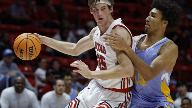 Nov 7, 2022; Salt Lake City, Utah, USA; Utah Utes center Branden Carlson (35) drives against LIU Sharks forward C.J. Delancy (15) in the first half at Jon M. Huntsman Center. Mandatory Credit: Jeffrey Swinger-USA TODAY Sports